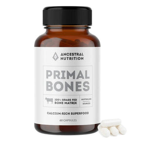 Primal Bones - 60 Capsules by Ancestral Nutrition, calcium-rich superfood supplement in amber bottle with white capsules alongside
