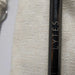 Close-up of the LYTES logo engraved on a black stainless steel straw