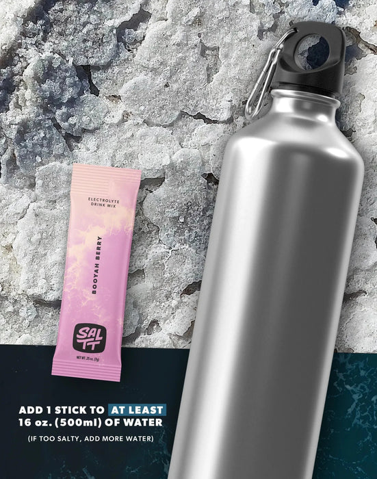 Booyah Berry Electrolyte Drink Mix - 30 Sticks sachet by SALTT next to silver water bottle on textured background