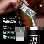 Hand pouring LMNT Raw Unflavoured Electrolyte Mix - 30 Sticks into a cup with graphic showing mixing instructions for various saltiness levels by LMNT.
