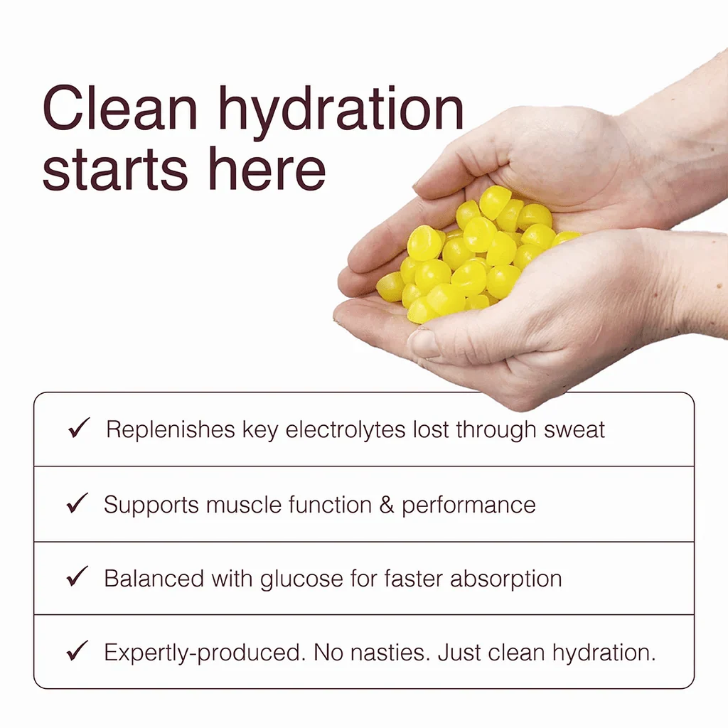 Hands holding yellow gummies with benefits of Swoleys LyteBites - Electrolyte Gummies - Lemon Surge for clean hydration and muscle support