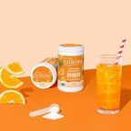 Orange Electrolyte Drink Mix - 90 Serves by Ultima Replenisher with sliced oranges and a glass of orange drink on orange background
