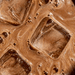 Close-up view of iced chocolate drink with creamy swirls, representing Sodii's Salty Chocolate - 30 Serve Tub, a keto-friendly low carb beverage.