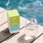 Salty Citrus - 30 Sachets by Sodii beside a glass of water poolside, from Drinks, Electrolytes, New Arrivals collections
