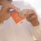 Person holding a sachet of Salty Grapefruit - 30 Sachets by Sodii from the Electrolytes and Drinks collections.